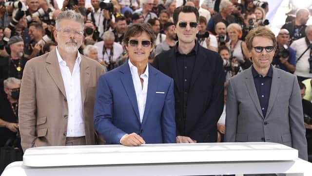 Screenwriter Christopher McQuarrie, from left, Tom Cruise, director Joseph Kosinski and producer Jerry Bruckheimer pose for photographers at the photo call for the film ‘Top Gun: Maverick’ at the 75th international film festival, Cannes, southern France, Wednesday, May 18, 2022. (Photo by Vianney Le Caer/Invision/AP)