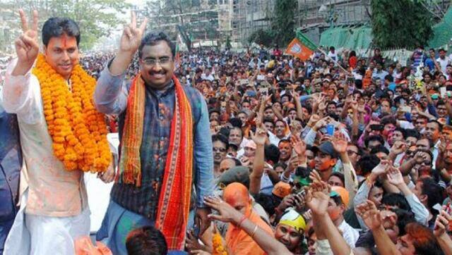 BJP then National General Secretary Ram Madhav and former Tripura BJP chief Biplab Kumar Deb display victory sign as they celebrate with supporters after party's victory in Tripura Assembly elections results in Agartala on 3 March 2018. BJP's win marks an end to 25 years of CPI-M government rule in the state. PTI