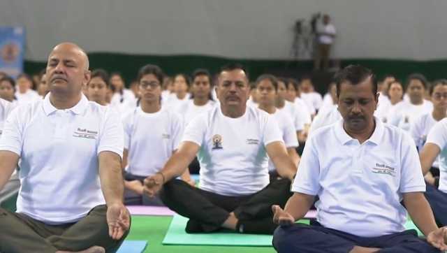 Yoga Day: Delhi CM Arvind Kejriwal performs asanas with hundreds at Thyagaraj stadium Yoga Day: Delhi CM Arvind Kejriwal performs asanas with hundreds at Thyagaraj stadium