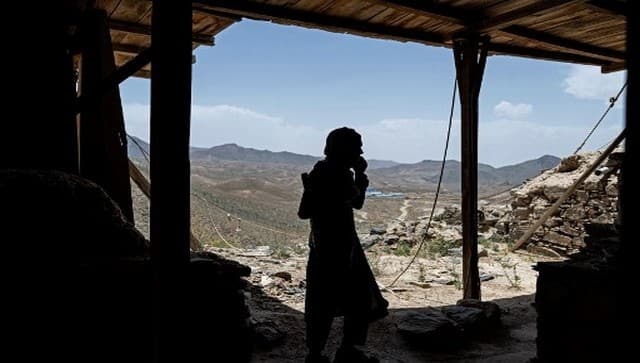 In this picture taken on May 17, 2022, a Taliban fighter walks at an archaeological site in Mes Aynak, in the eastern province of Logar. AFP