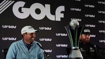 Charl Schwartzel celebrates as golf's power struggle deepens