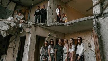 High school students pose for graduation photo in Ukraine's war-torn Chernihiv