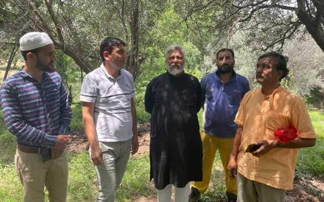 Rajendra Singh, Sanjay Tula with OSD SDM Uri Tahir and Tariq Ahmed at an olive orchard in Salamabad. Image courtesy Indra Shekhar Singh