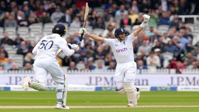England’s Joe Root, right, and Ben Foakes celebrate as England win by five wickets on the fourth day of the first Test between England and New Zealand at Lord’s cricket ground in London, on Sunday. AP