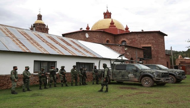 Mexican soldiers arrive to the church in Cerocahui, Mexico. AP