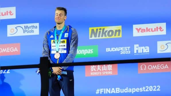 Mykhailo Romanchuk wins medal in pool while father fights in Ukraine