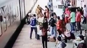 Watch|Woman falls while trying to board moving train, RPF personnel averts tragedy