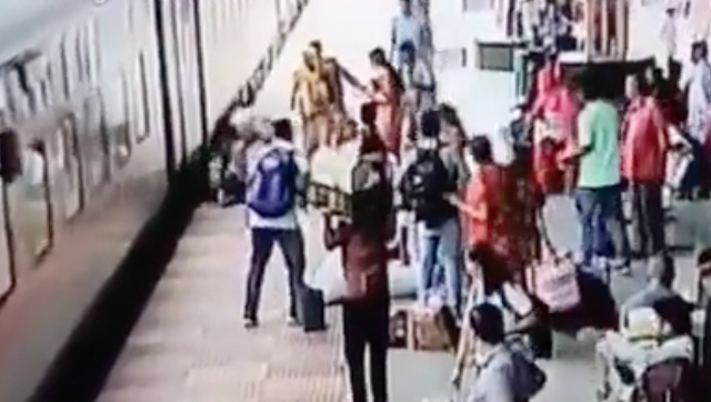 Watch|Woman falls while trying to board moving train, RPF personnel averts tragedy Watch|Woman falls while trying to board moving train, RPF personnel averts tragedy