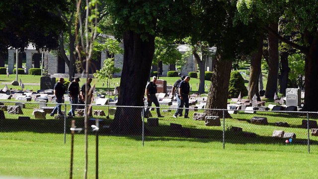 Two people shot at Wisconsin cemetery, says police; urge people to stay away from area Two people shot at Wisconsin cemetery, says police; urge people to stay away from area