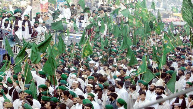 Pakistani Muslims belonging to the Dawat-e-Islami organisation take part in a religious procession in Lahore. Members of the group wear the green turban, which is representative of the green dome of the mosque at Madina. AFP