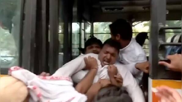 Watch: Congress' Srinivas dragged into police bus as he dramatically tries to escape