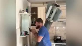 Watch: Ukrainian man casually shaves while rocket lies embedded in home; internet amazed