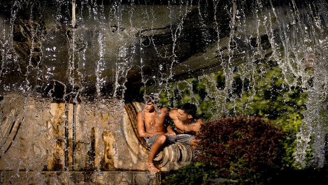 Locals and tourists across Spain, Italy and Romania flocked to lakes, beaches and city fountains to find reprieve from the extreme heat. AP