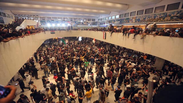 Iraqi protesters fill the Parliament building in Baghdad, Iraq. AP