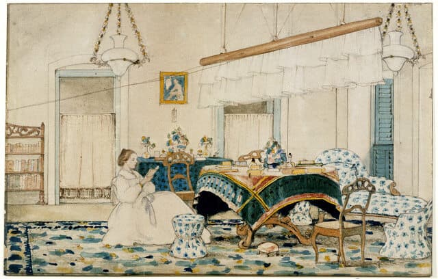 A woman reading under a punkah in a comfortably furnished room. Inscribed on reverse: 'Mrs Gladstone Lingham's drawing room at her residence in Berhampore, 1863'. Wikimedia Commons/ British Library