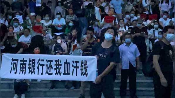 China banks to repay some customers after mass protests