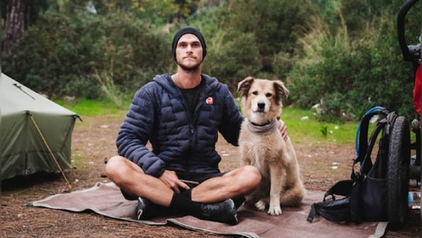 Bow wow! Meet the first dog to walk around the world – with his master