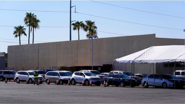 Americans queue up in long lines at food banks as inflation hits new high
