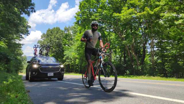 Kabir Rachure quenches his thirst during the RAAM ultra cycling expedition. Image courtesy Shail Desai 