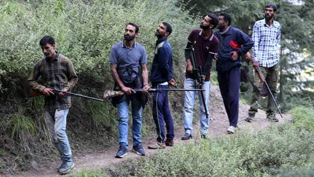 Hunters during a chase to find the leopard in Bonier Baramulla forests. Image courtesy Mohammad Abu Bakar 