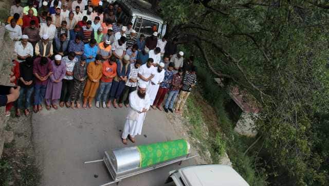 People offering funeral prayers near the coffin of a 12-year-old girl Rutba Manzoor who was killed by a leopard in her village on 14 June 2022. Image courtesy Mohammad Abu Bakar
