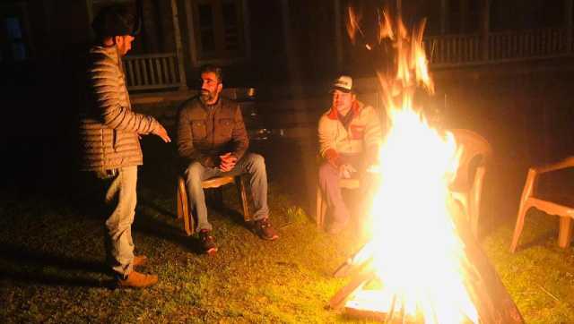 Tourists enjoying a bonfire in Keran. Image courtesy Tasaduq Hussain