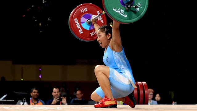 India's Chanu Saikhom Mirabai in action during the Women's 49kg weightlifting event at The NEC on day two of the Commonwealth Games in Birmingham, England, Saturday July 30, 2022. (Bradley Collyer/PA via AP)