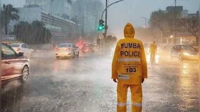 Heavy rain puts Mumbai on yellow alert: Water-logged roads bring traffic to a standstill; landslide hits Ghatkopar