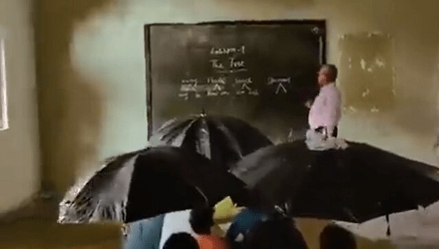 Watch: School students in MP hold umbrellas inside classroom as roof leaks, video goes viral Watch: School students in MP hold umbrellas inside classroom as roof leaks, video goes viral