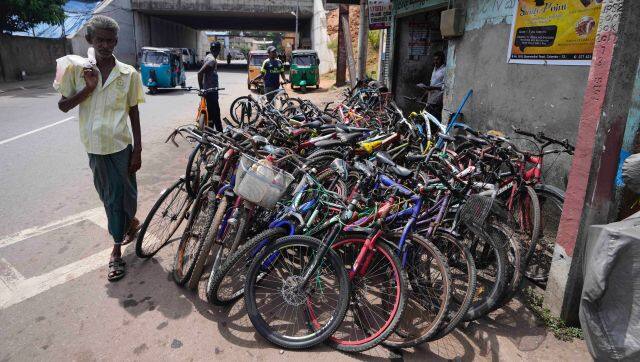 Bicycles brought to be repaired are seen outside a workshop amid fuel shortage in Colombo, Sri Lanka, Tuesday, July 5, 2022. Sri Lanka's ongoing negotiations with the International Monetary Fund have been complex and difficult than the instances before because it has entered talks as a bankrupt nation, the country's prime minister said Tuesday. (AP Photo/Eranga Jayawardena)