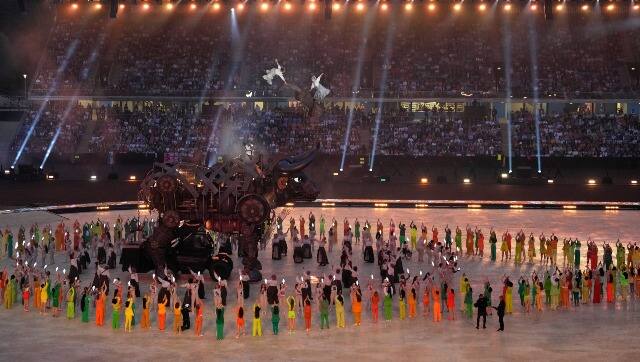 Cast members performed with a giant mechanical bull during the opening ceremony at the Alexander stadium. The Bull was 10m high and took 5 months to be completed. AP Photo
