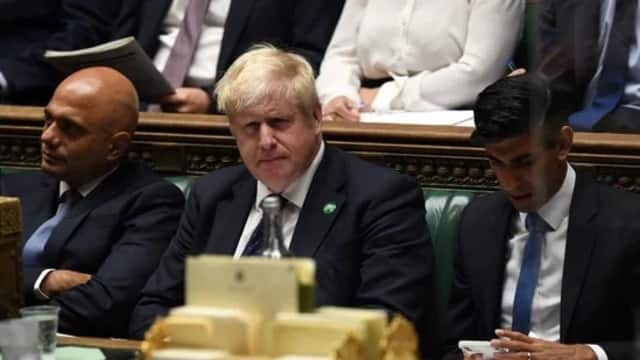 Britain's former Health Secretary Sajid Javid (L), Prime Minister Boris Johnson (C) and former Chancellor of the Exchequer Rishi Sunak. AFP