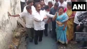 Andhra Pradesh: YSRCP MLA enters overflowing drain as mark of protest