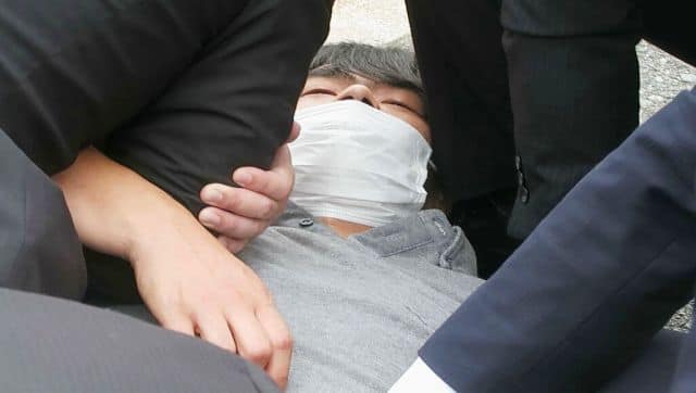 Tetsuya Yamagami has been arrested. He is a former military member. AP
