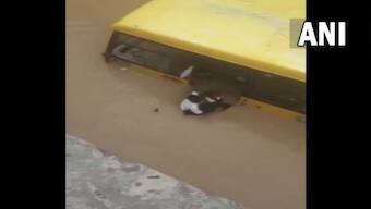 Watch: Locals rescue 30 students from school bus partially submerged in flooded street in Telangana