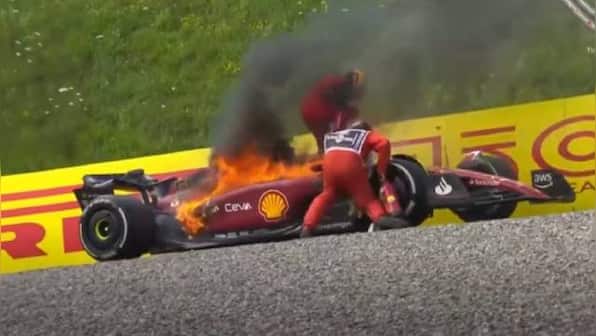 Watch: Carlos Sainz's Ferrari catches fire during Austrian GP as Spanish driver jumps out of car