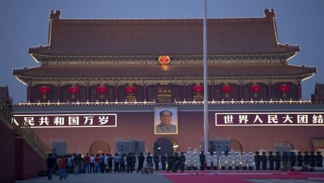 Chinese honour guards stand in formation in front of Tiananmen Gate in Beijing. AFP