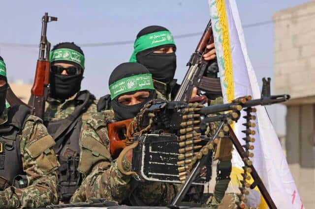 Members of the Ezz-Al Din Al-Qassam Brigades, the armed wing of the Palestinian Hamas movement, parade in Rafah in the southern Gaza Strip in May 2021. AFP