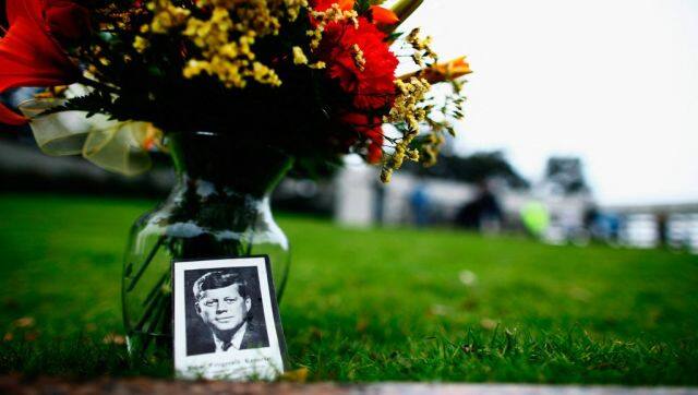 Flowers are placed at a memorial in Dealey Plaza in Dallas, Texas. President John F Kennedy was killed as he rode in a Presidential motorcade. AFP 