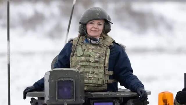 Liz Truss poses in a tank as she visits British troops in Estonia. Image courtesy: Simon Dawson/No 10 Downing Street