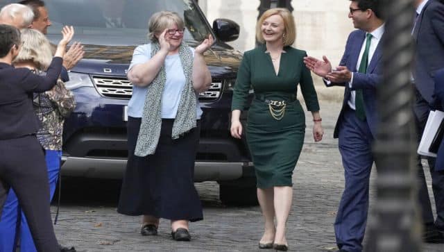 Liz Truss receives applause from her team near Parliament in London, as she become one of the two finalists in an election to replace Prime Minister Boris Johnson. AP