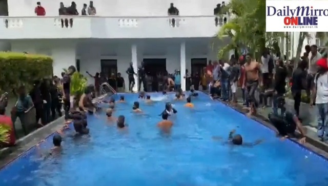 Watch | Protestors swim in President Gotabaya Rajapaksa’s pool, enter kitchen after storming his official residence Watch | Protestors swim in President Gotabaya Rajapaksa’s pool, enter kitchen after storming his official residence