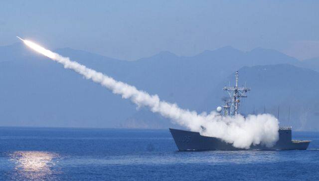 A Cheng Kung class frigate fires an anti-air missile as part of a navy demonstration in Taiwan's annual Han Kuang exercises off the island's eastern coast near the city of Yilan, Taiwan on 26 July. The Taiwanese capital Taipei staged a civil defence drill Monday and President Tsai Ing-wen on Tuesday attended the annual military exercises. AP