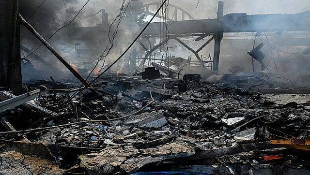 A burning building of a chemical factory was destroyed following a missile strike in the second largest Ukrainian city of Kharkiv, amid Russia's invasion of Ukraine. AFP
