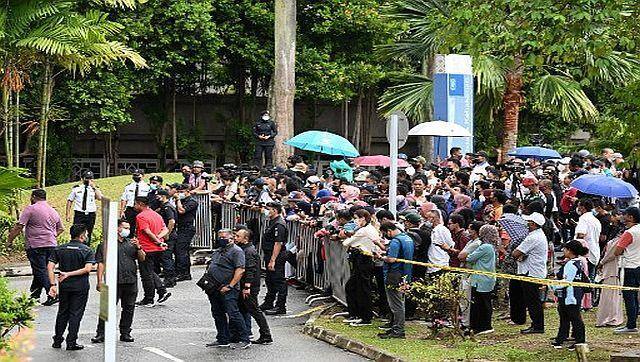 Supporters of Malaysia's former prime minister Najib Razak gather outside the country's highest court after it upheld the former leader's corruption conviction over the 1MDB financial scandal. AFP