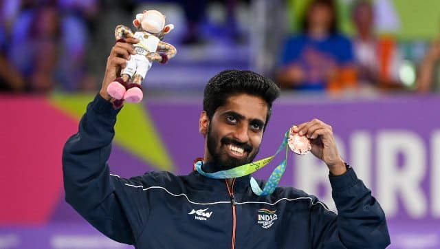 Paddler G Sathiyan poses with the bronze medal after beating England’s Paul Drinkhall. AP 