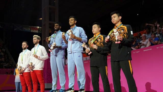 India’s men’s doubles pair of Satwiksairaj Rankireddy and Chirag Shetty pose with the gold medal after winning the badminton final on Monday. AP 
