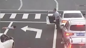 Watch: Child falls out of car's window on busy road in China, motorists rush to rescue