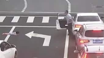 Watch: Child falls out of car's window on busy road in China, motorists rush to rescue