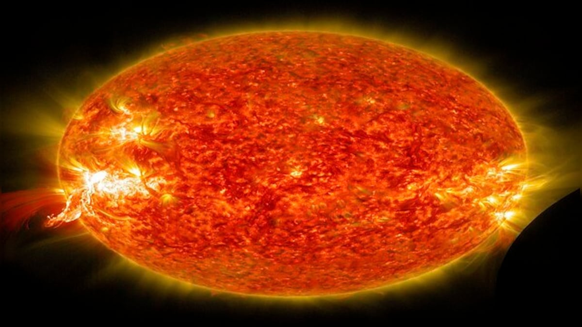 What are solar flares that can reach temperatures up to 100 million degrees?